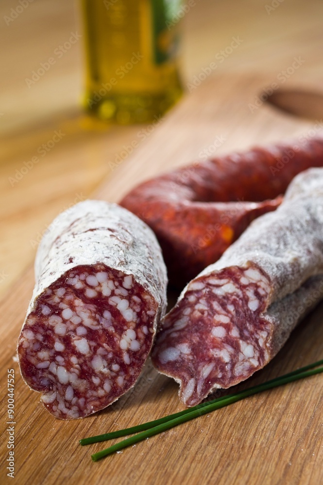 Close-Up 4K image of Slicing Very Thin Salami Sausage for Charcuterie
Close-Up 4K image of Slicing Very Thin Salami Sausage for Charcuterie