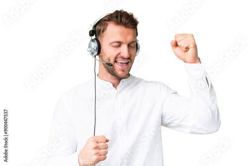 Telemarketer caucasian man working with a headset over isolated chroma key background celebrating a victory photo