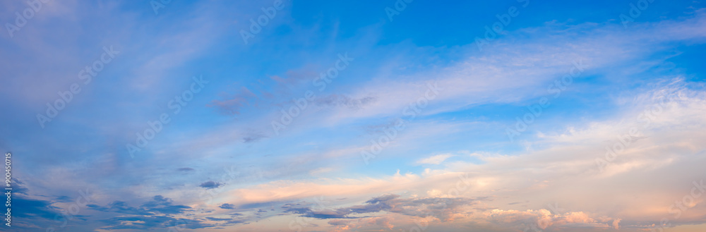 A beautiful blue sky with pink clouds. The sky is a perfect backdrop for a beautiful day A beautiful blue sky with pink clouds. The sky is a perfect backdrop for a beautiful day