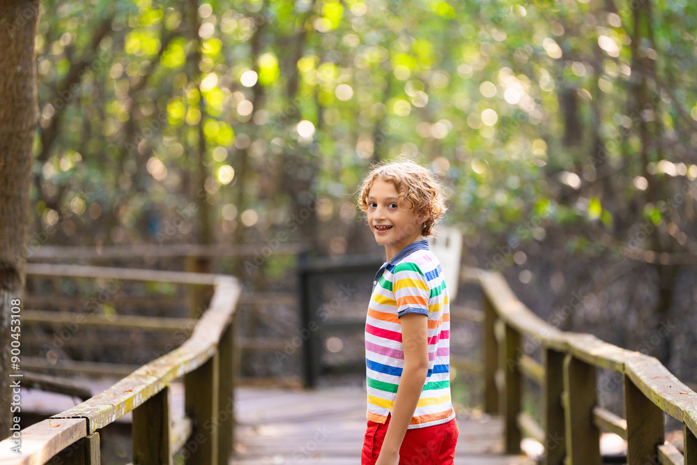 Kids explore nature. Children hike in sunny park. Kids explore nature. Children hike in sunny park.