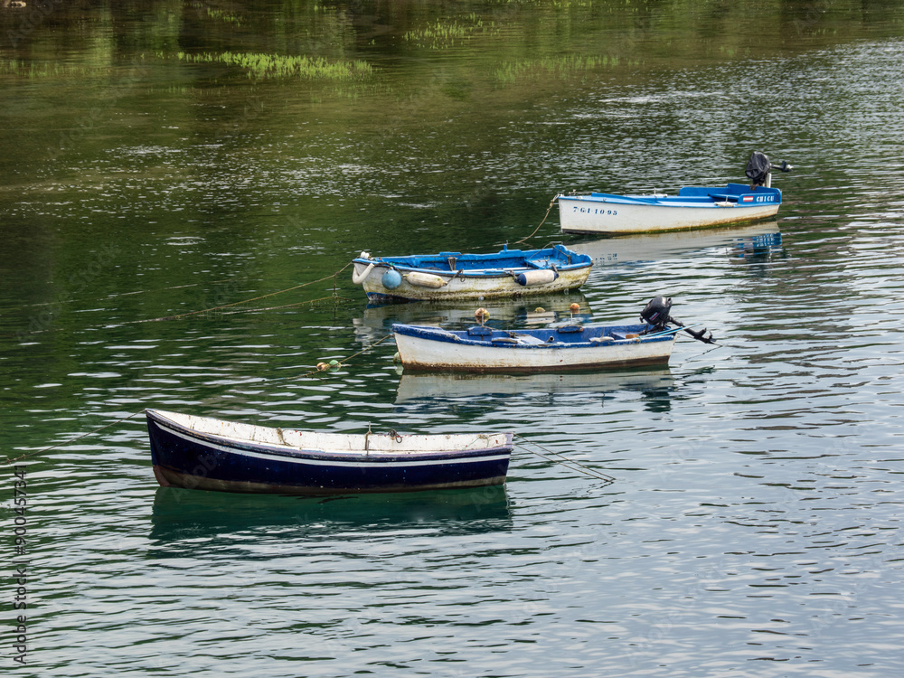 Small fishing boats in the estuaries of San Vicente de la Barquera (Cantabria, Spain) Small fishing boats in the estuaries of San Vicente de la Barquera (Cantabria, Spain)