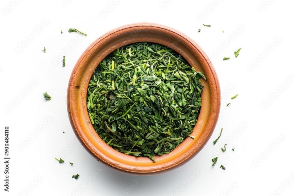 Fresh green leaves arranged in a wooden bowl on a white background Fresh green leaves arranged in a wooden bowl on a white background