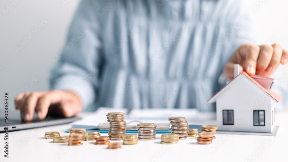 © JD8 - Investment in a home often involves securing a mortgage loan, with a finance agent helping to manage business and property aspects of the house to ensure best use of your money. investment, loan.