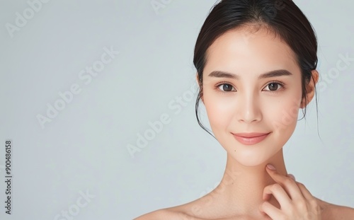 Woman Smiling Against Light Blue Background