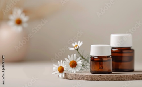 Chamomile Essential Oil Bottles on Wooden Coaster