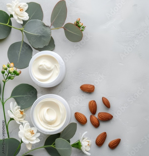 Almond Cream Jars on Marble Surface