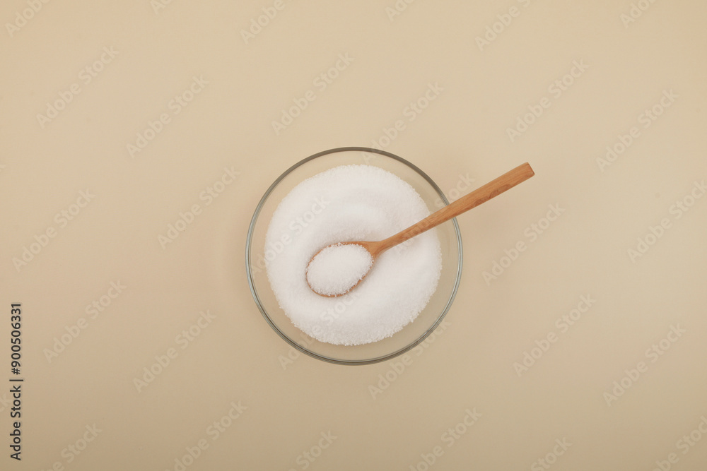 Sugar substitute in glass plate with spoon. Sugar substitute in glass plate with spoon.