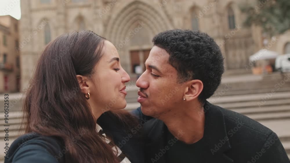 Young couple of tourists laughing in front of cathedral. Young couple of tourists laughing in front of cathedral.