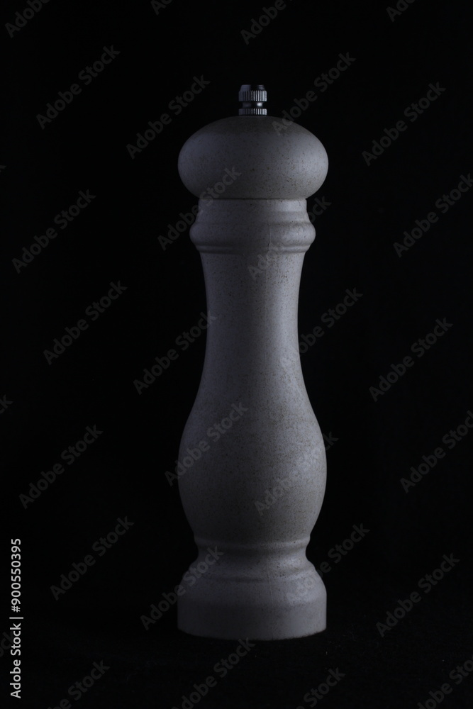 Fototapeta premium white pepper shaker on a dark background
