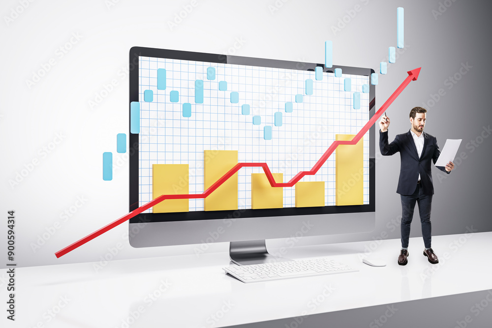 Businessman analyzing market graph on a computer screen.