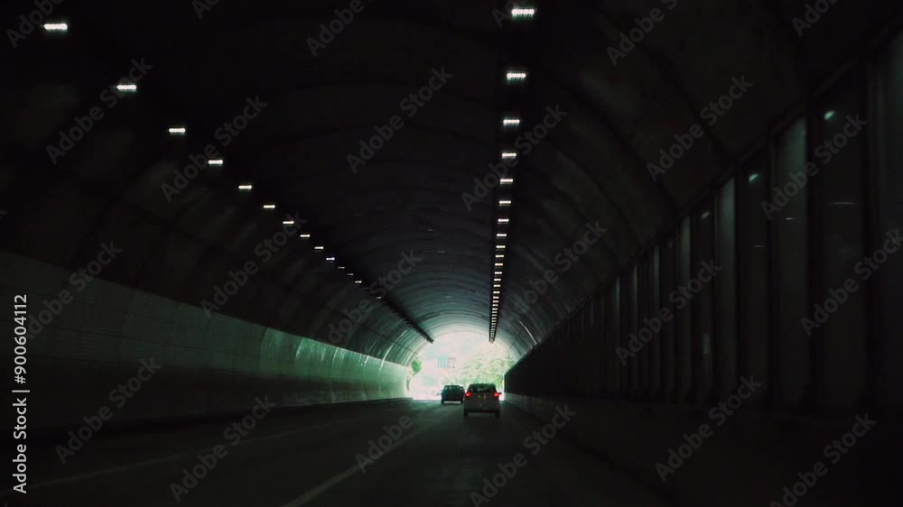 cars running through the tunnel on the highway cars running through the tunnel on the highway