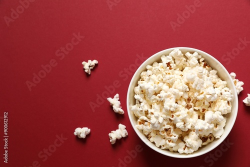 Delicious popcorn on a colored background