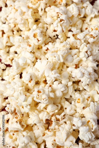 Delicious popcorn on a colored background