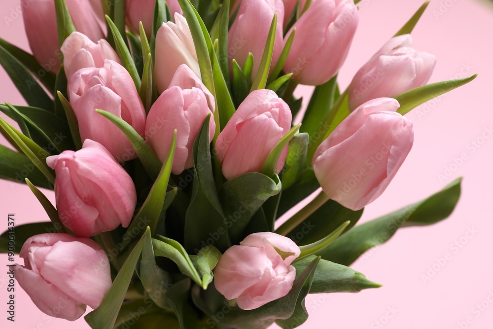Naklejka premium Beautiful fresh tulips on color background