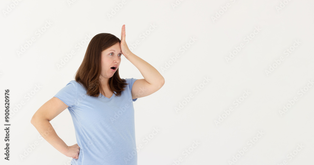 Gosh why me. Portrait of unhappy and annoyed young woman in blue t-shirt facepalming with irritation breathing out with opened mouth and rolling eyes from annoyance and exhaust Gosh why me. Portrait of unhappy and annoyed young woman in blue t-shirt facepalming with irritation breathing out with opened mouth and rolling eyes from annoyance and exhaust