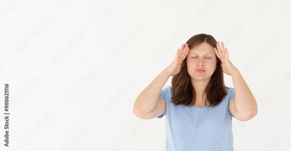 Woman with hard headache holding hands on head. Brunette woman touching her temples feeling stress, on white background. Woman suffering from headache. Woman with hard headache holding hands on head. Brunette woman touching her temples feeling stress, on white background. Woman suffering from headache.
