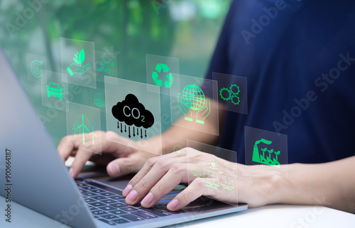 Reduce CO2 emission concept. Businessman use laptop computer with environment icon. technology Net zero and Carbon neutrality, green business and development based on renewable energy. Climate Change,