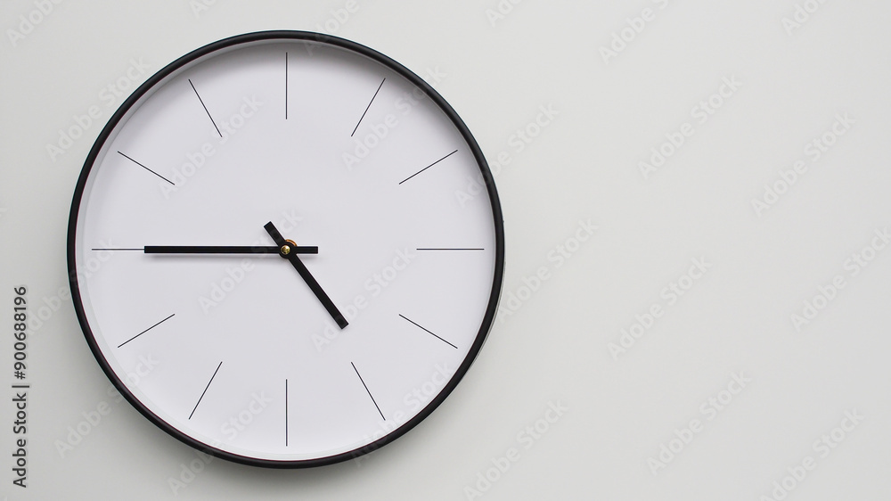 Wall Clock Showing 16.45/04.45 O'Clock on White Wooden Surface - Perfect for Time Management and Scheduling Concepts Wall Clock Showing 16.45/04.45 O'Clock on White Wooden Surface - Perfect for Time Management and Scheduling Concepts