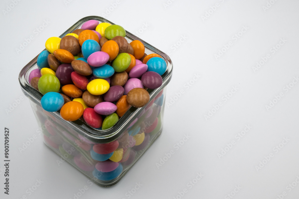 Colorful candies in sweet chocolate.
Colorful candies in sweet chocolate.