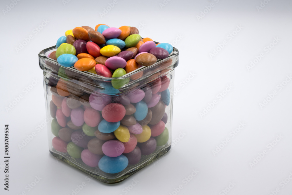 Colorful candies in sweet chocolate.
Colorful candies in sweet chocolate.