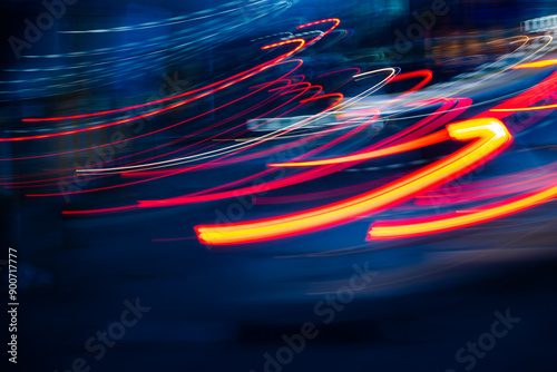 A blurry image of a car with red and blue streaks. Concept of motion and speed, as if the car is in the middle of a race or driving at high speeds