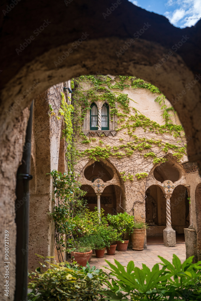 Mediterranean Courtyard With Arched Walkways And Lush Greenery, cimbrone villa in Ravello, Italy