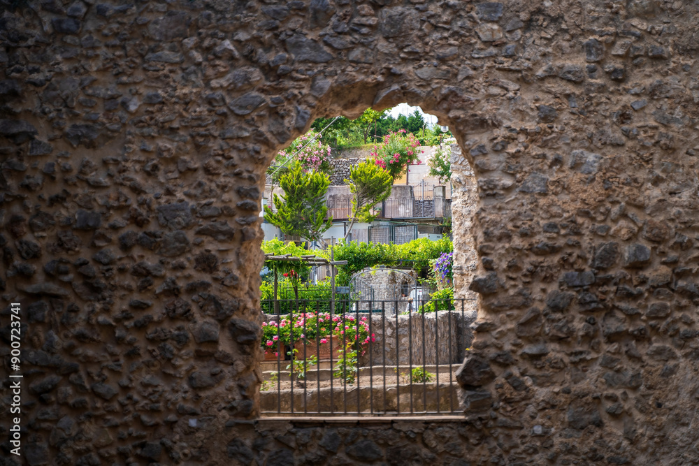 Scenic Stone Archway Framing a Lush Garden Landscape, cimbrone villa in Ravello, Italy