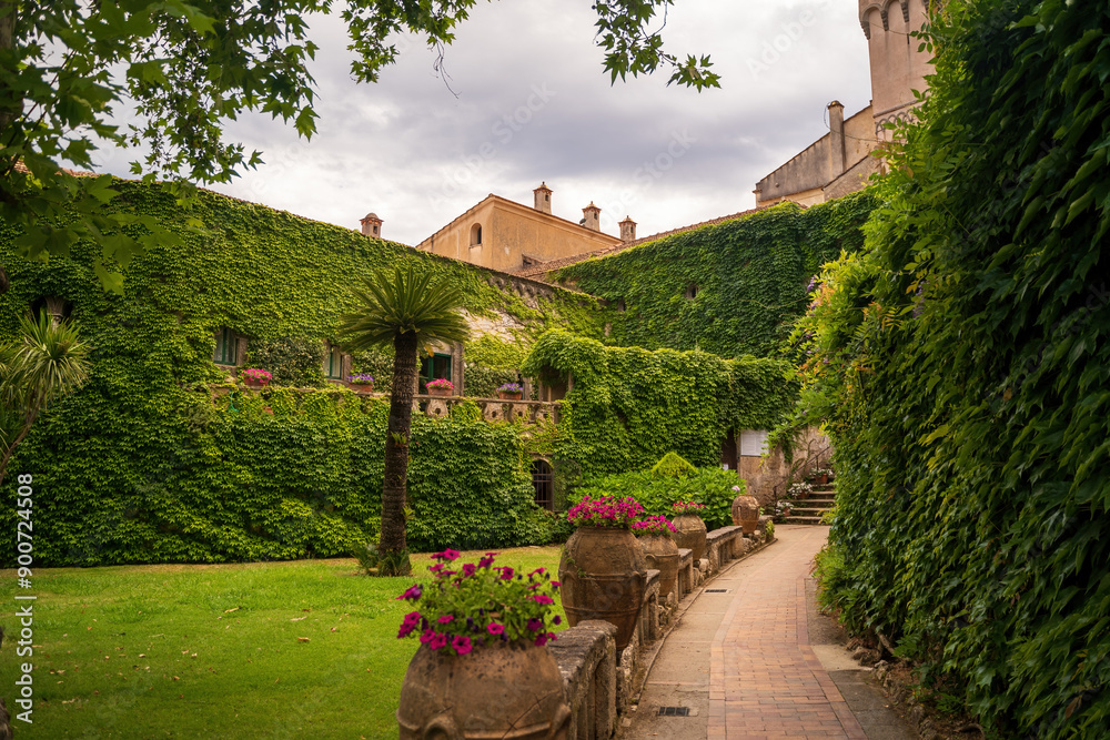 Scenic Courtyard with Ivy-Covered Buildings and Pathway, cimbrone villa in Ravello, Italy