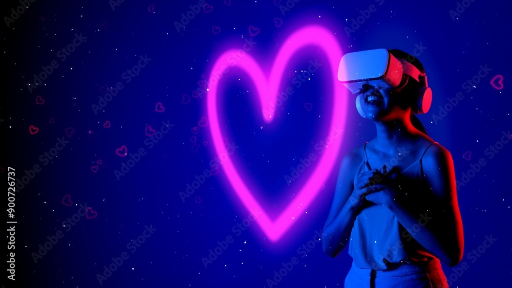 Fototapeta premium Beautiful Asian woman in VR to metaverse interacting virtual neon flowers drawing lighting pink heart with fingers blossom blue background 3D pollen graphic floating meta garden world. Hallucination.
