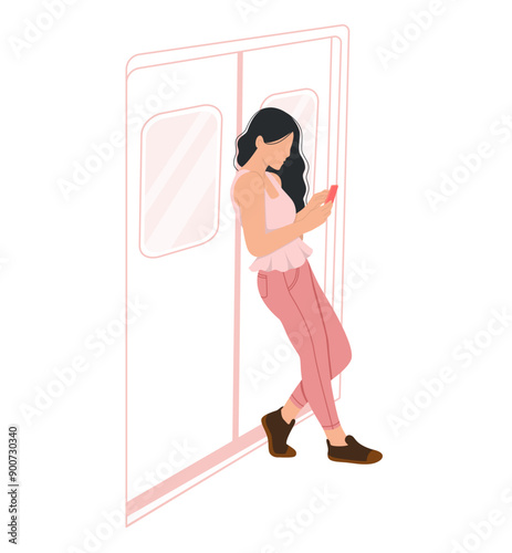 A woman using smartphone leaning against a train exit door