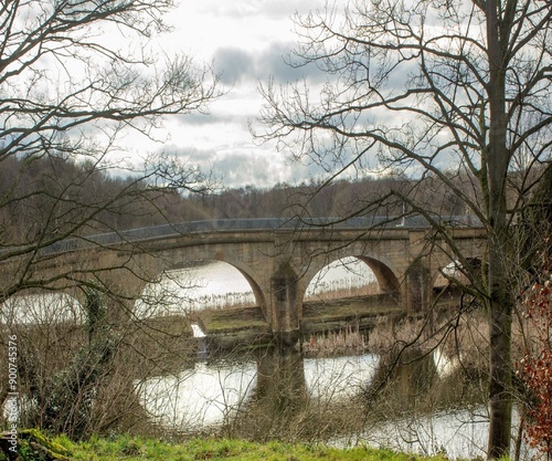 Stone bridge in pond at Nostell Priory England..