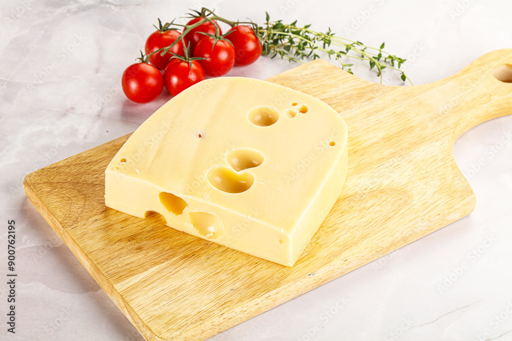 Maasdam cheese brick over board