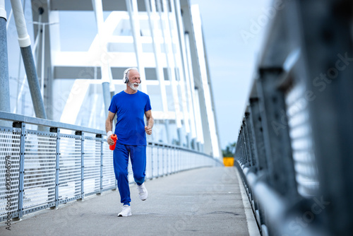 Fit and healthy senior man running in retirement.