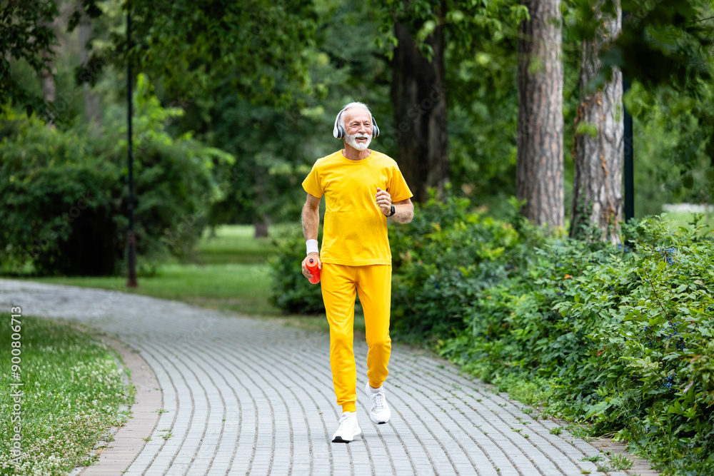 Senior man running in the park. Training for better health. Senior man running in the park. Training for better health.