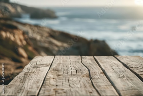 A chic modern style wood table set against coastal cliffs