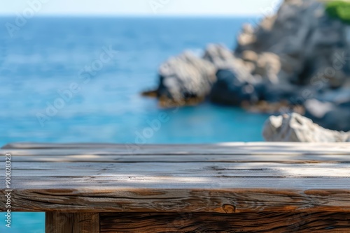 A chic modern style wood table set against coastal cliffs