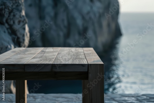 A chic modern style wood table set against coastal cliffs