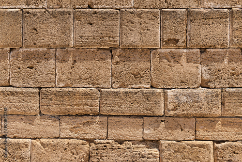 Ancient Greek stone wall texture background.