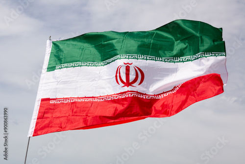 Photos Iran flag waving against the blue sky
