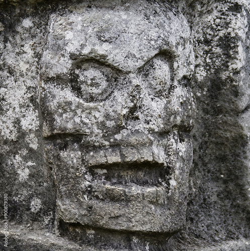 Details of the famous Tzompantli (wall of skulls) of Chichen Itza, (Yucatan, Mexico) a structure for publicly displaying the skulls of defeated or sacrificed enemies.