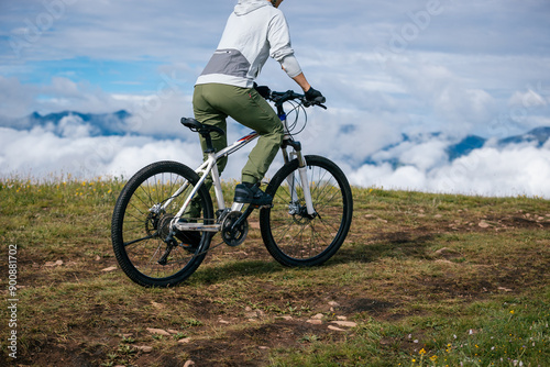 Riding mountain bike on beautiful mountain top