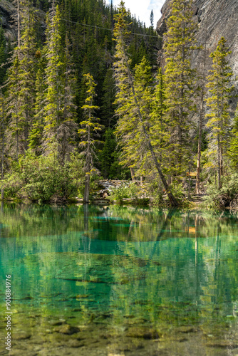 Breathtaking views of the upper and lower Grassi Lakes with brilliant turquoise and aqua waters set in a serene wilderness outside the town of Canmore near Kananaskis during the summer season.
