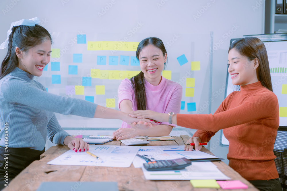 Brainstorming of a team of young Asian women, Asian creative teamwork group in a new business meeting to develop a project with... Brainstorming of a team of young Asian women, Asian creative teamwork group in a new business meeting to develop a project with...