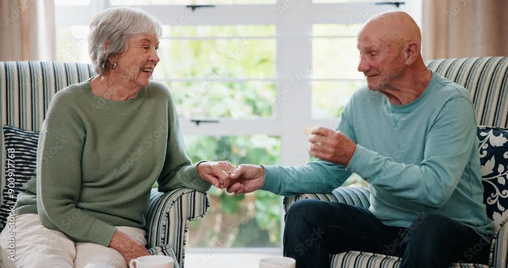 Conversation, holding hands and love with old couple eating biscuits in living room of home together. Relax, retirement or smile with senior man and woman in apartment for bonding, rest or tea break