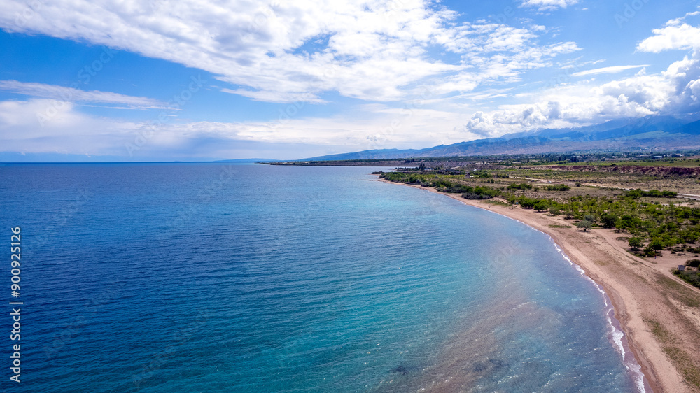 Fototapeta premium Sunny summer day on the lake. Kyrgyzstan, Lake Issyk-Kul