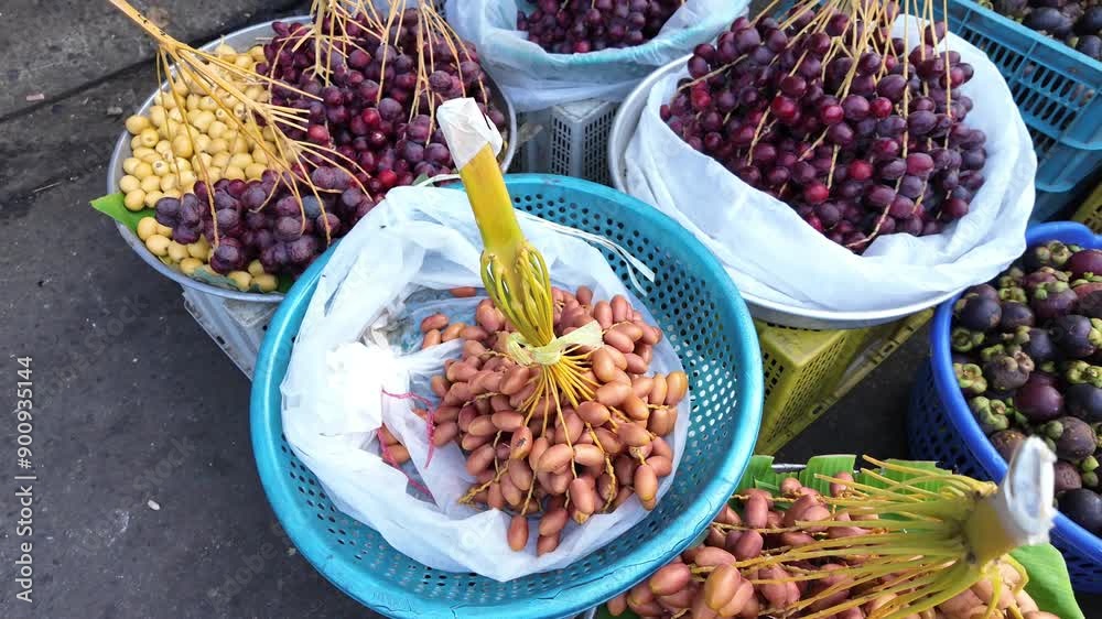Date palm fruit for sale show on card at outdoor fruits market, Cho Lon, Vietnam Date palm fruit for sale show on card at outdoor fruits market, Cho Lon, Vietnam