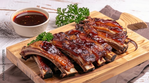 Delicious BBQ ribs served on a wooden platter with parsley garnish. Perfect for food enthusiasts and culinary photography.