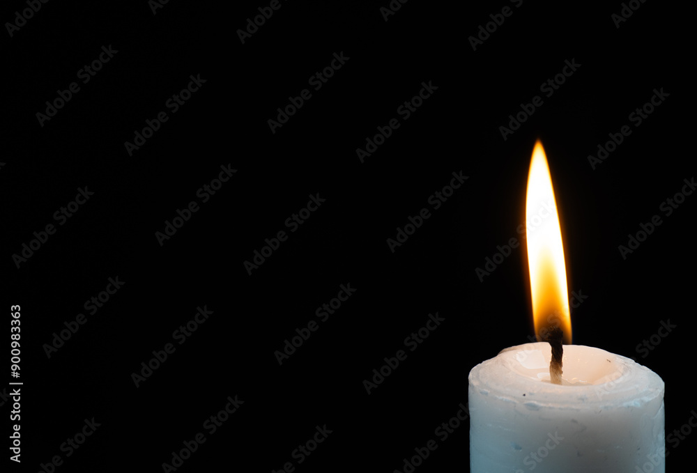 lit candle on corner isolated black background lit candle on corner isolated black background