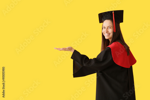 Young female graduate showi...