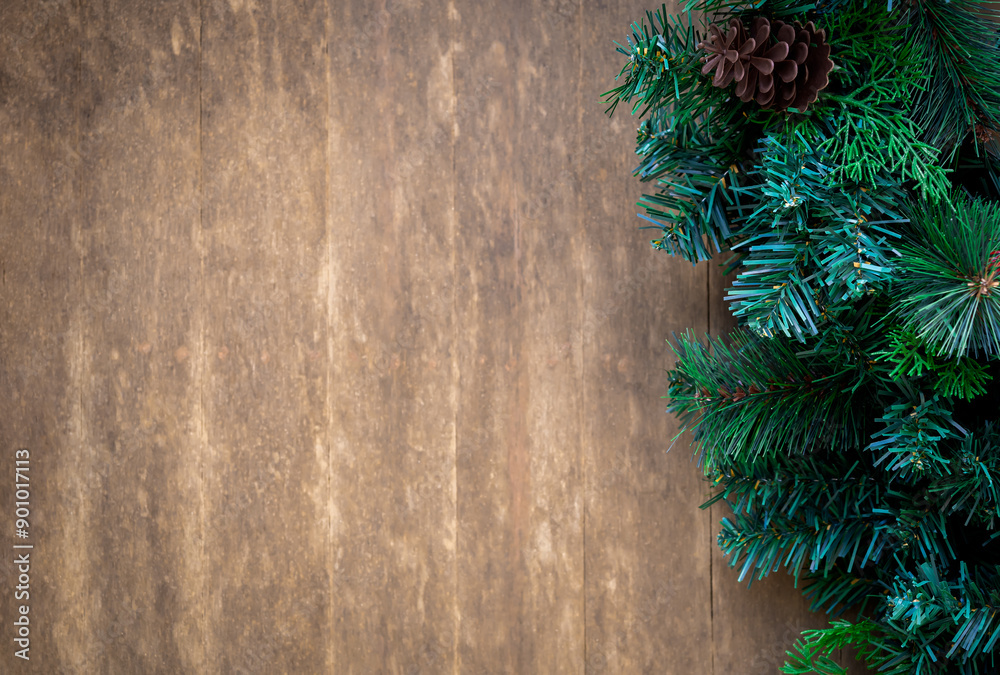 Merry Christmas and Happy New Year concept. Close-up green Christmas tree decorated with pinecone on old wooden board background with copy space, festive party ornament banner, simple style. Merry Christmas and Happy New Year concept. Close-up green Christmas tree decorated with pinecone on old wooden board background with copy space, festive party ornament banner, simple style.